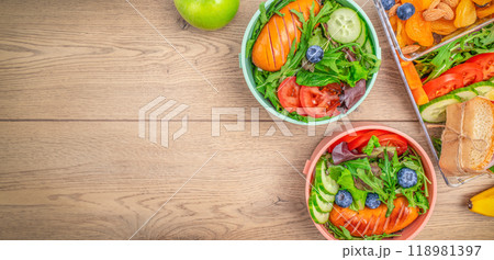 Lunch box, snacks on wooden background, concept of vacation nutrition, tourism, healthy snack 118981397