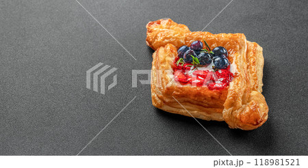 Delicious puff pastry with berries on a dark background. banner, menu, recipe place for text, top view 118981521