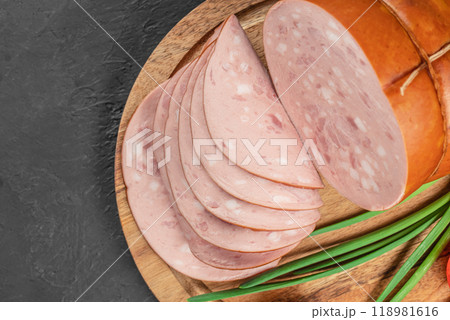 Tasty meat sausages. Turkey Boiled Ham on a wooden board, top view. copy space Tasty meat sausages. Turkey Boiled Ham on a wooden board, top view. copy space 118981616
