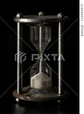 Silver hourglass (Sandglass) on Dark background. 118981675