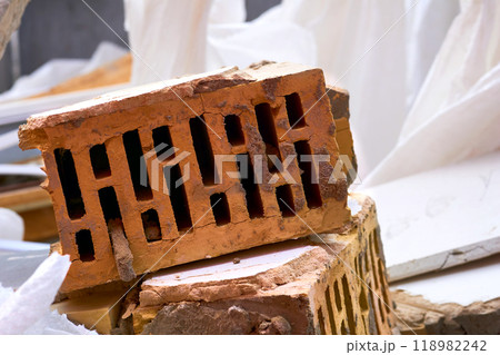 Red orange brick left after the destruction.After the disaster 118982242