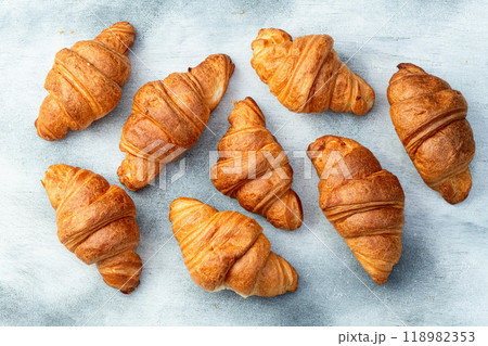 Group of sweet croissant . French morning breakfast . Top view Group of sweet croissant . French morning breakfast . Top view 118982353