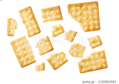 Broken square water crackers isolated on white background, top view. Broken square water crackers isolated on white background, top view. 118982493