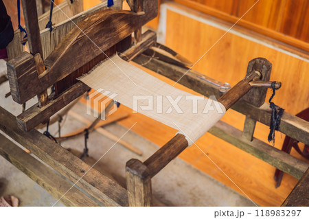 Village women busy weaving silk saree on handloom 118983297