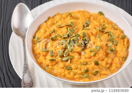butternut squash puree with pumpkin seeds in bowl 118983680
