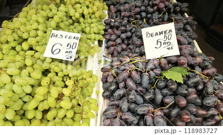 Ripe grape of different varieties on a counter at a market in Bulgaria 118983727