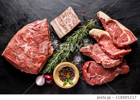 Selection of Fresh Meats and Flavorful Spices Beautifully Presented on Rustic Background Selection of Fresh Meats and Flavorful Spices Beautifully Presented on Rustic Background 118985217
