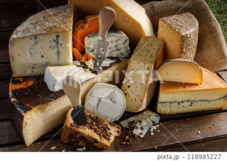 An Exquisite and Delicious Assortment of Artisan Cheeses Accompanied by Cutting Tools An Exquisite and Delicious Assortment of Artisan Cheeses Accompanied by Cutting Tools 118985227