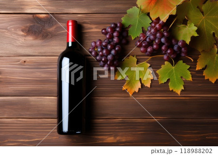 red wine, grapes and wine on wooden table 118988202