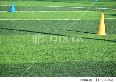 artificial green grass soccer field with training cones artificial green grass soccer field with training cones 118990108