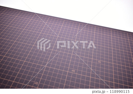 black cutting mat board on white background with line and scale measure guide pattern 118990115