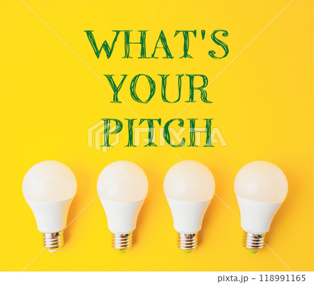 Four white light bulbs arranged in a row on a yellow background Four white light bulbs arranged in a row on a yellow background 118991165