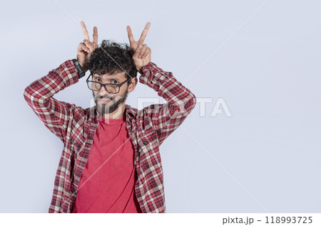 Isolated man with cuckolded fingers. concept of disloyalty, Cuckold man isolated, concept of infidelity and cuckolding, unfaithful person 118993725