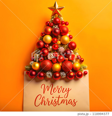 Festive Christmas card lies next to the Christmas tree 118994377