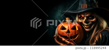 Scary Witch Holding a Carved Halloween Pumpkin on a Black Background - Generative Ai 118995244