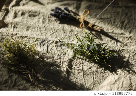 Bunch of fresh herbs on wooden table at home. Rosemary, thyme and lavender 118995773