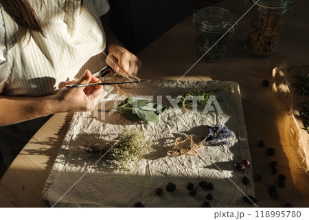 Middle selection sprigs of fresh herbs on wooden table at linen tablecloth. Rosemary, thyme, lavender and sage Middle selection sprigs of fresh herbs on wooden table at linen tablecloth. Rosemary, thyme, lavender and sage 118995780