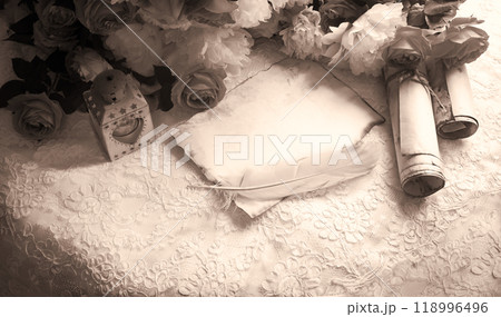 Paper with quill and flowers 118996496