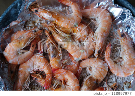 Grilled shrimps baked red on a pan and foil 118997977