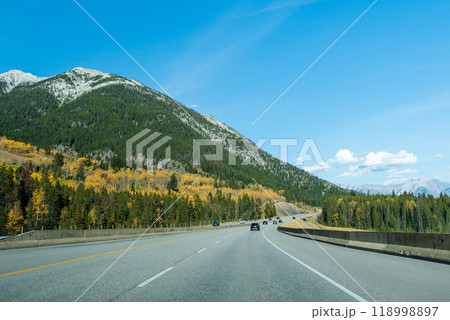 Driving on Trans-Canada Highway (Highway 1) in a autumn sunny day. Banff National Park, Canadian Rockies. Alberta, Canada. 118998897