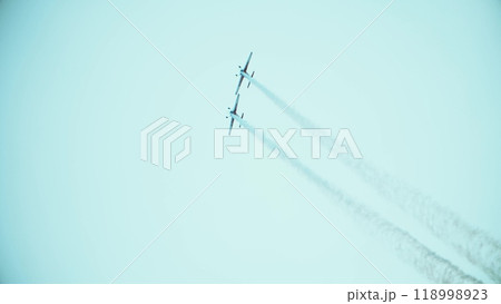 Telephoto lens shot of two propeller planes performing aerobatics maneuvers during the airshow. Teamwork or double effort concept 118998923