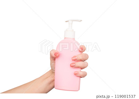 female hands hold liquid soap bottle with copy space female hands hold liquid soap bottle with copy space 119001537