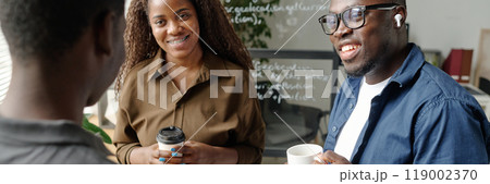 Website banner with young African American business team chatting with each other during coffee break Website banner with young African American business team chatting with each other during coffee break 119002370