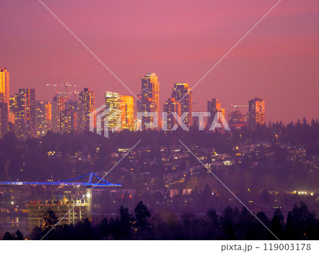 Unusual night city silouette highlighted with sunset rays in Surrey, BC 119003178