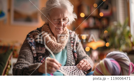 A retiree with arthritis knits intricate patterns for charity, making an impact despite physical challenges. 119006471