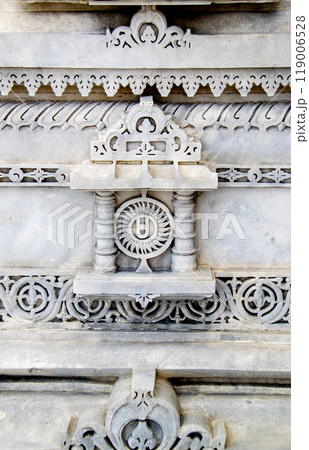 A white marble sculpture of a Hindu saint in the temple. Oldest temple in India. Beautiful sculpture of ancient India 13th century. Wall mounting background. Wall poster.  119006528