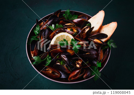 Fresh, Boiled mussels, Black Sea, with parsley and lemon, no people, top view Fresh, Boiled mussels, Black Sea, with parsley and lemon, no people, top view 119008045