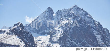 Snow mountain landscape banner, blue sky, rocky cliff. Wild nature. Hight mountains trekking 119008303
