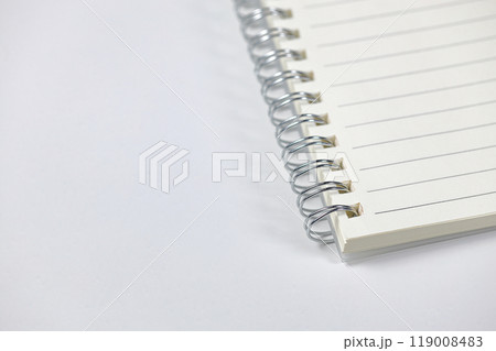 Close up Ring-bound notebook or appointment book  isolated on white background. Stationery item. 119008483