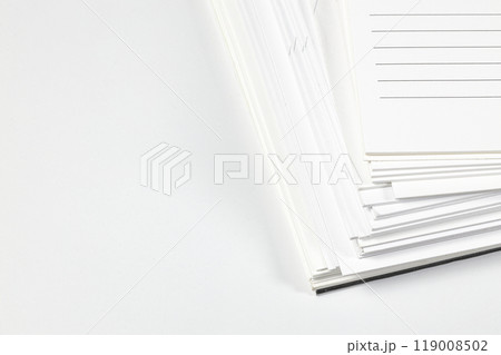 Close up stack of note papers isolated on white background. Stationery item. Close up stack of note papers isolated on white background. Stationery item. 119008502