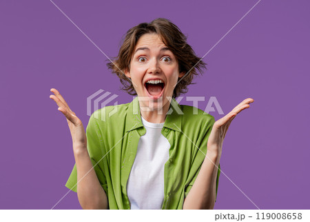 Surprised woman, she expresses WOW, cant believe. Impressed lady trying to get attention. Concept of sales, profitable offer. Excited romantic girl on violet background 119008658