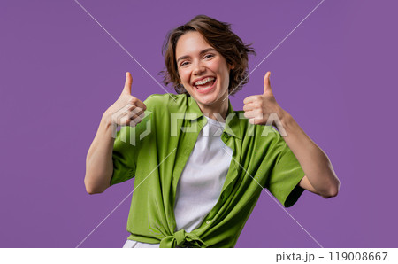 Stylish woman with hand sign like, thumbs up gesture. Happy lady, correct perfect choice, great deal, violet background. Positive female model smiles to camera, approval, trust concept 119008667