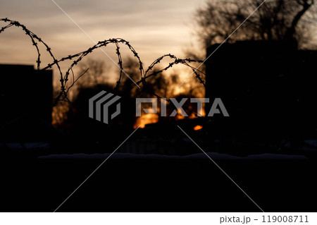 Barbed wire on the prison fence. A closed prison. Security concept. Forbidden territory. 119008711