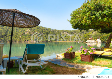 View of Blue Lagoon with Sun Loungers and Umbrellas at a Tropical Resort in Oludeniz, Turkey 119008993