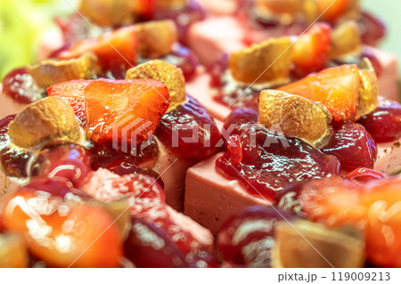 Fruit mousse pastries with berry jelly and fresh strawberries Fruit mousse pastries with berry jelly and fresh strawberries 119009213