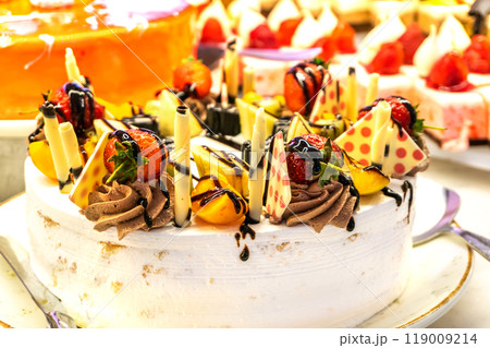 Yogurt Cake Decorated with Berries and Chocolate Yogurt Cake Decorated with Berries and Chocolate 119009214