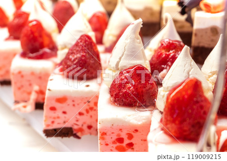 Strawberry Mousse Pastries with Whipped Cream and Fresh Strawberries Strawberry Mousse Pastries with Whipped Cream and Fresh Strawberries 119009215