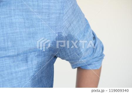 man with wet armpits Smelly odor from sweat . man with wet armpits Smelly odor from sweat . 119009340