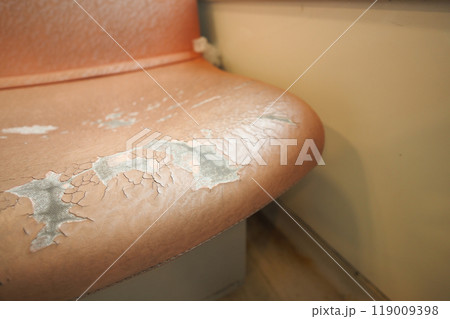 damage Leather with a cracked texture on a sofa . 119009398