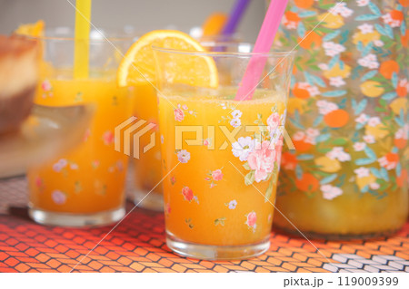 A Refreshing and Zesty Citrus Drink Perfectly Served in Beautifully Flowered Glasses A Refreshing and Zesty Citrus Drink Perfectly Served in Beautifully Flowered Glasses 119009399