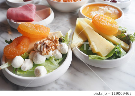 A Vibrant and Colorful Fresh Salad Comprising Fruits and Cheese Served in Decorative Bowls A Vibrant and Colorful Fresh Salad Comprising Fruits and Cheese Served in Decorative Bowls 119009465