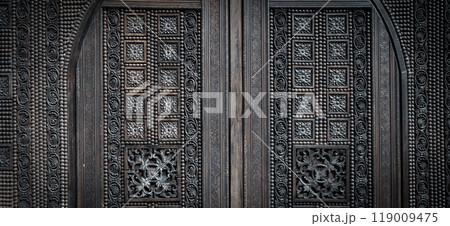 Traditional carving, wooden door with decorative elements. Traditional carving, wooden door with decorative elements. 119009475