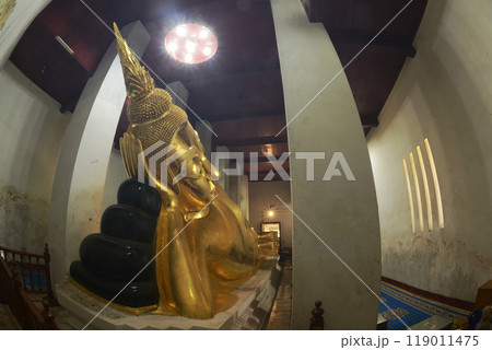 Golden Reclining Buddha in Sermon Hall ( Vihara ) at Wat Thammickarat. It is 12 meters long and faces north. His feet are covered with gold and decorated with glass. At Ayutthaya Historical Park. Golden Reclining Buddha in Sermon Hall ( Vihara ) at Wat Thammickarat. It is 12 meters long and faces north. His feet are covered with gold and decorated with glass. At Ayutthaya Historical Park. 119011475