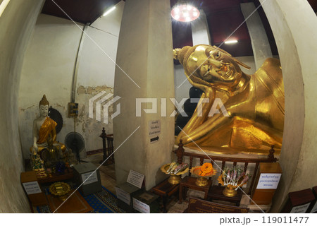 Golden Reclining Buddha in Sermon Hall ( Vihara ) at Wat Thammickarat. It is 12 meters long and faces north. His feet are covered with gold and decorated with glass. At Ayutthaya Historical Park. Golden Reclining Buddha in Sermon Hall ( Vihara ) at Wat Thammickarat. It is 12 meters long and faces north. His feet are covered with gold and decorated with glass. At Ayutthaya Historical Park. 119011477