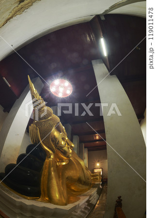 Golden Reclining Buddha in Sermon Hall ( Vihara ) at Wat Thammickarat. It is 12 meters long and faces north. His feet are covered with gold and decorated with glass. At Ayutthaya Historical Park. Golden Reclining Buddha in Sermon Hall ( Vihara ) at Wat Thammickarat. It is 12 meters long and faces north. His feet are covered with gold and decorated with glass. At Ayutthaya Historical Park. 119011478