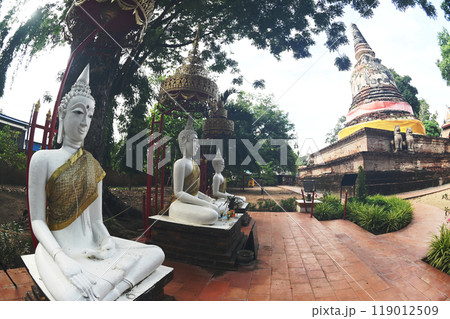 The group of white sitting Buddha decorated near main chedi of Wat Mae Nang Pluem. Located at Phra Nakhon Si Ayutthaya Historical park in Thailand. The group of white sitting Buddha decorated near main chedi of Wat Mae Nang Pluem. Located at Phra Nakhon Si Ayutthaya Historical park in Thailand. 119012509